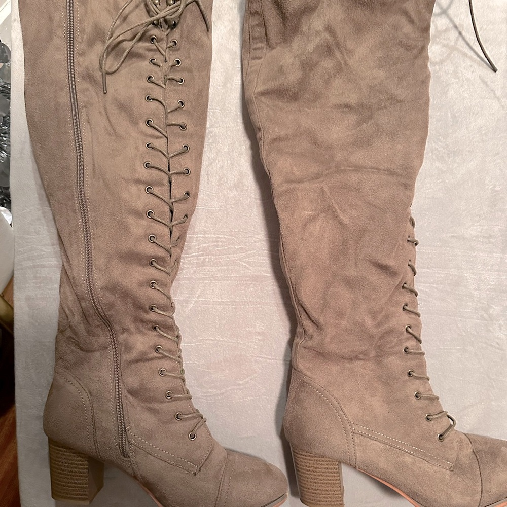 Thigh high boots with zipper and lace detail